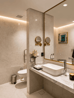 Marble vanity with sink and mirror in Accessible Room at Naviti by Warwick Jeddah, capturing stylish hotel rooms in Jeddah