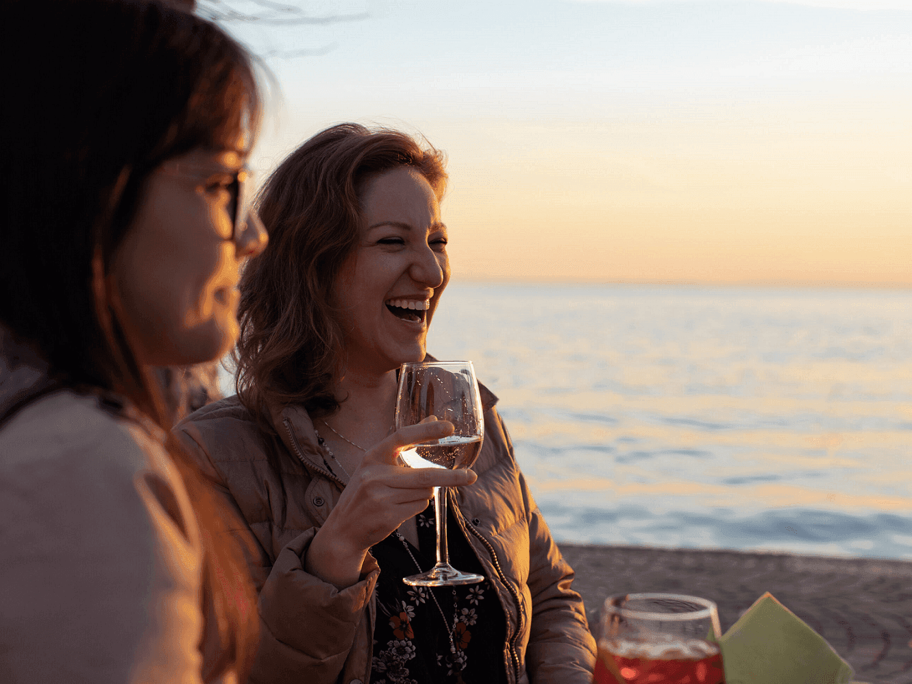 two women drinking wine