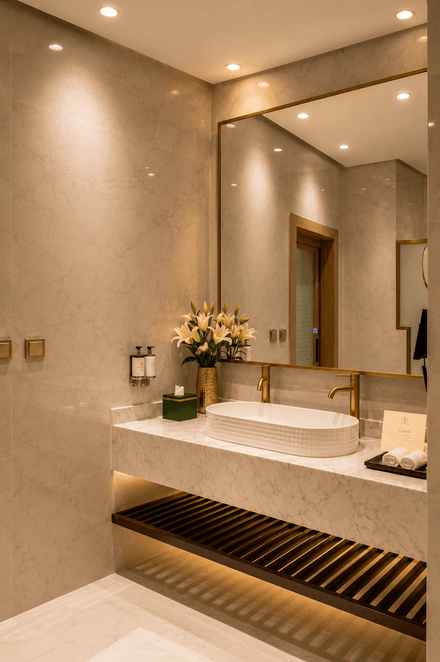 Sink with brushed faucet with lilies in Executive Suite at Naviti by Warwick Jeddah, capturing stylish hotel rooms in Jeddah