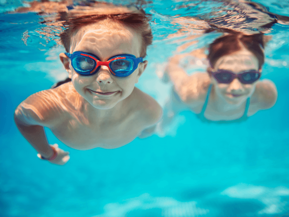 2 kids swimming underwater in pool at Jacobs Aquatic Center near Bayside Inn Key Largo