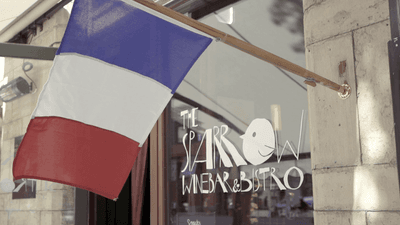 A flag at the entrance of the Wine Bar at The Sparrow Hotel