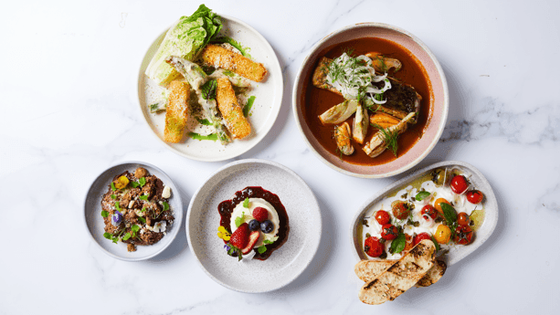 Collection of beautifully plated modern dishes with seafood, salads, and desserts at 33Grill Bar & Dining in Novotel Sydney