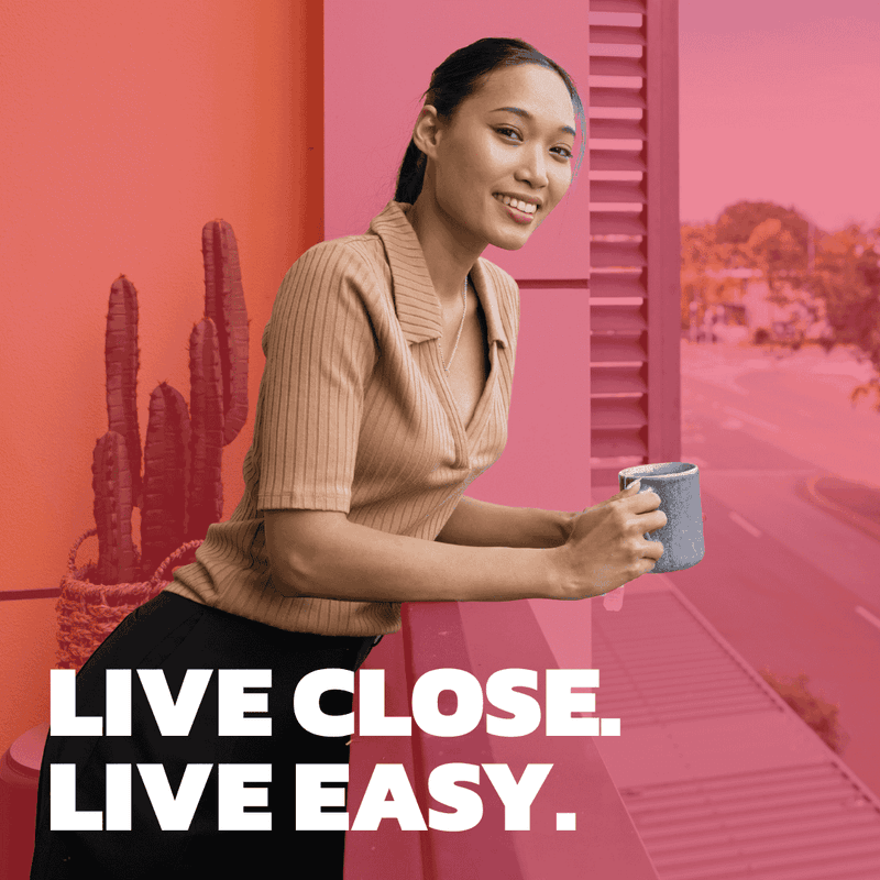 Woman holding a cup with Live Close, Live Easy text overlay at UniLodge Darwin.
