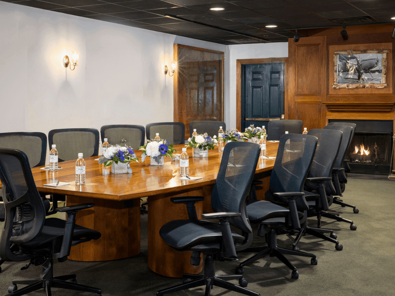 Conference table set up with wooden interior in Sasanoa Room at Harraseeket Inn