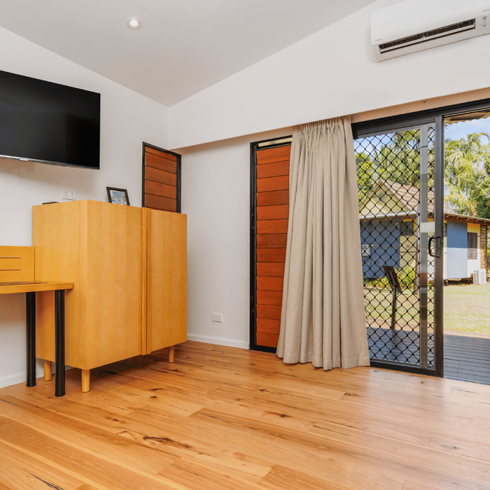 TV, desk & cupboard in Deluxe Bungalow, Novotel Darwin Airport