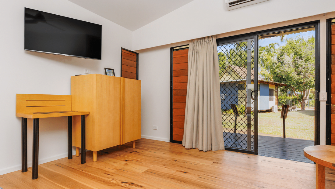 TV, desk & cupboard in Deluxe Bungalow, Mercure Darwin Airport