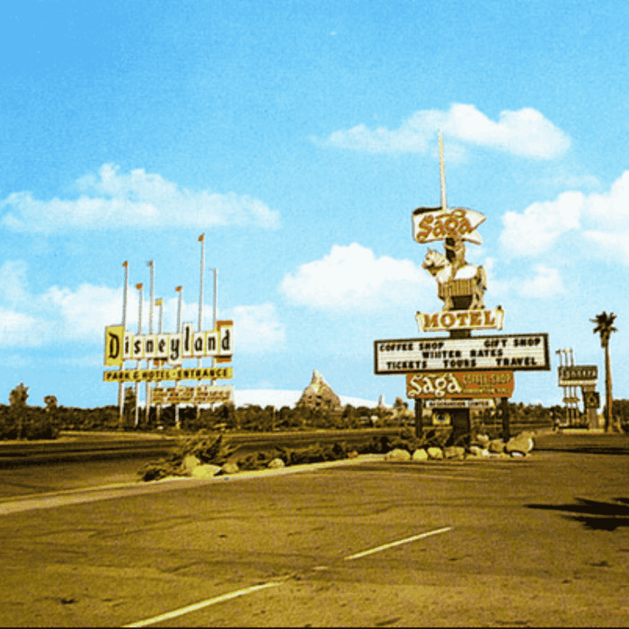 Disneyland entrance and Saga Motel signs on a sunny day at Grand Legacy at The Park Anaheim