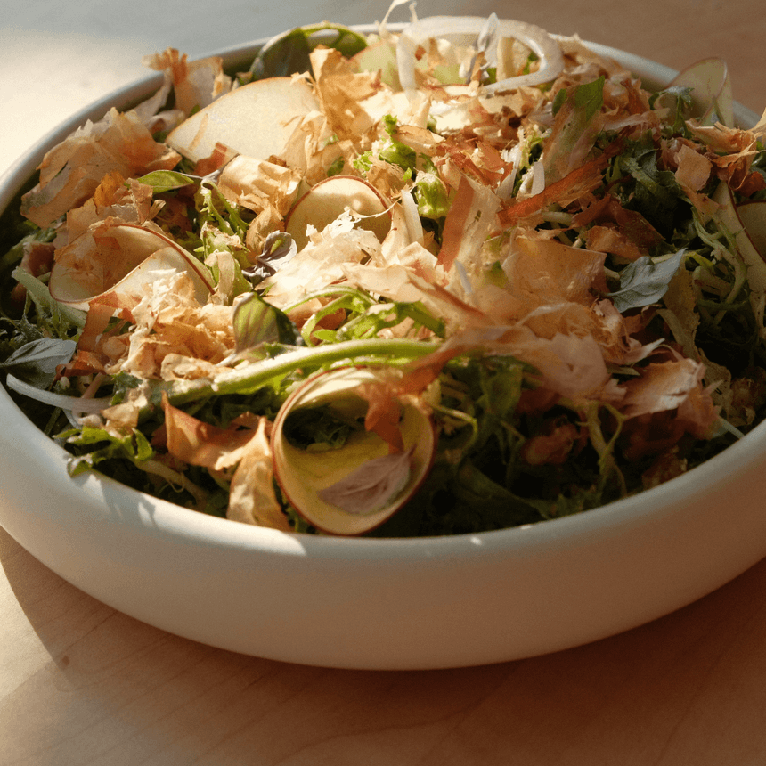 Salad with greens, apples, and bonito flakes served at The Stonebreaker Hotel