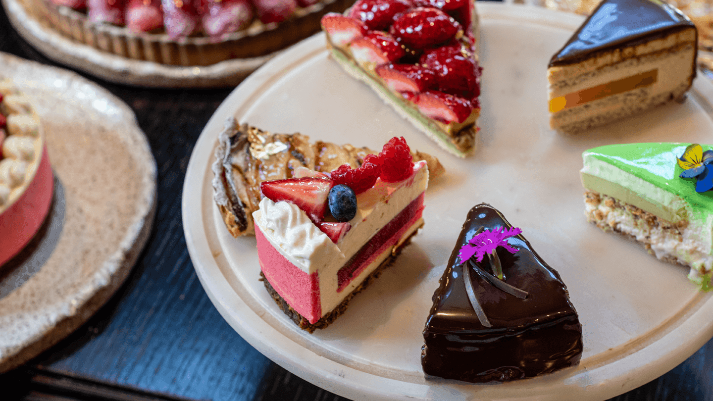 Assortment of cake piece on a plate at Emporium Hotel South Bank
