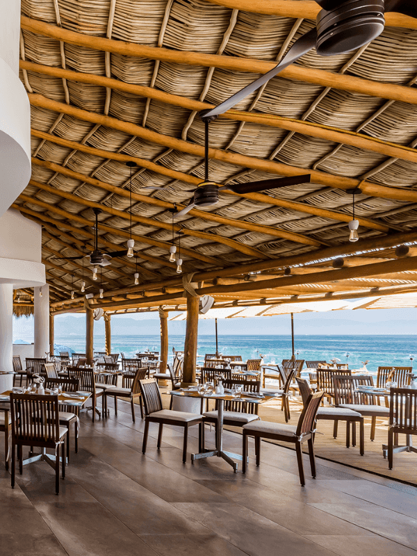 Dining area of Sunset Restaurant with ocean view at Buenaventura Grand Hotel and Spa