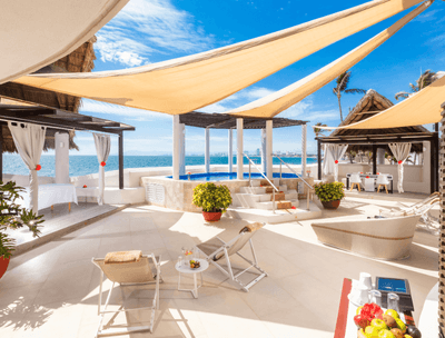 Shakti Spa with pool, loungers, cabana, and ocean view at Buenaventura Grand Hotel and Spa