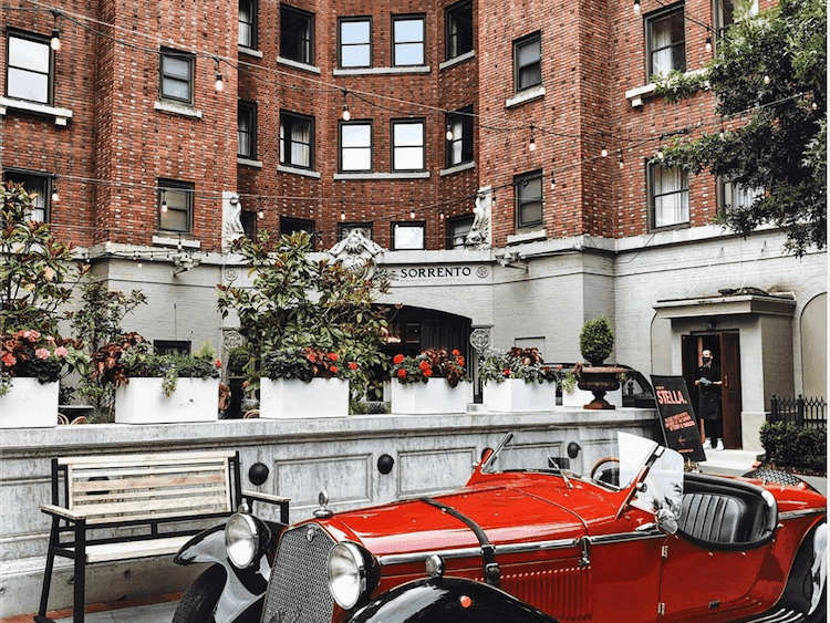 Close up of a vintage car parked in front of Hotel Sorrento