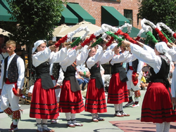 A group of women dancing Basque Block near The Grove Hotel