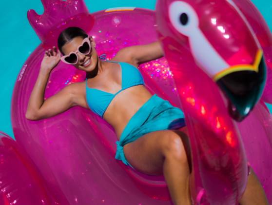 Girl in a pool on a flamingo floatie at Clevelander South Beach