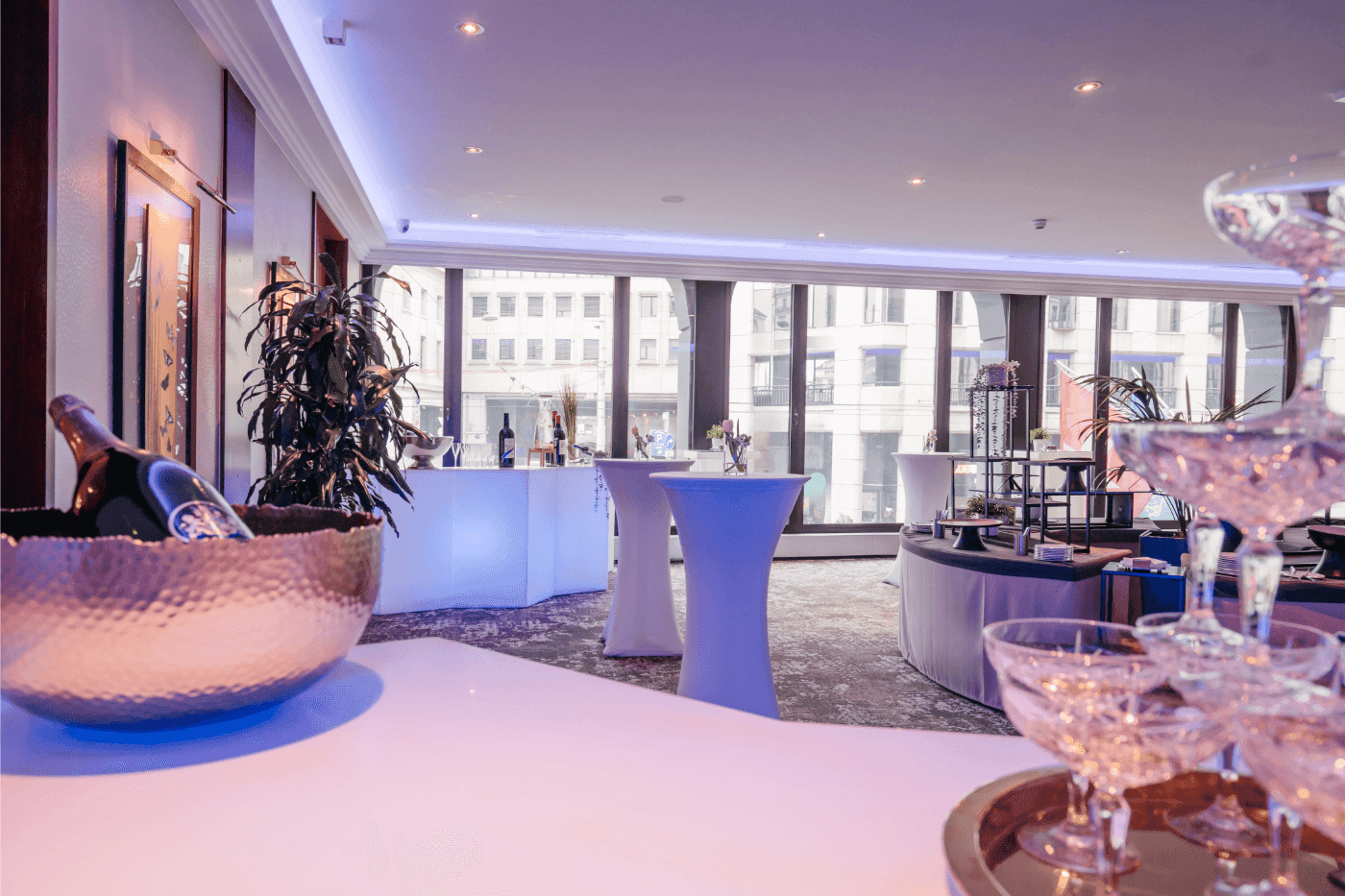 Elegant drink setups, and large windows with a city view in Foyer Mezzanine at Warwick Geneva