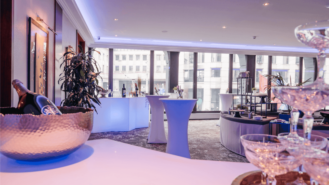 Elegant drink setups, and large windows with a city view in Foyer Mezzanine at Warwick Geneva