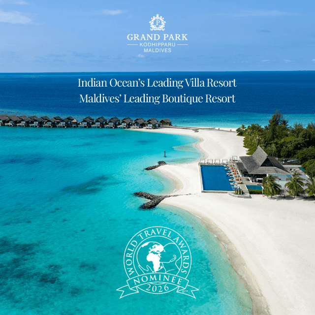 Aerial view of overwater villas, white sand beach, infinity pool, and turquoise lagoon at Grand Park Kodhipparu, Maldives