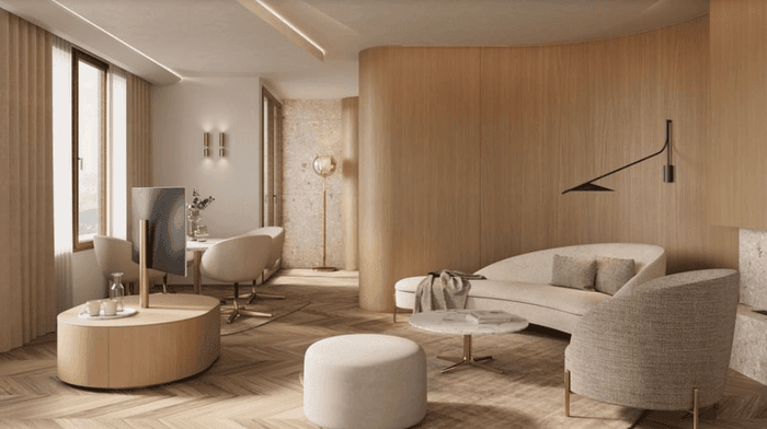 TV lounge area with plush seating by the window in Suite Panorama Wellness with balconies at Hotel des Innovations
