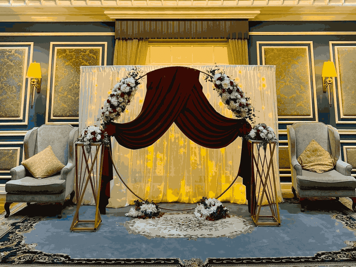 Blue Room event setup with floral decorations and chairs at Warwick Doha in Doha