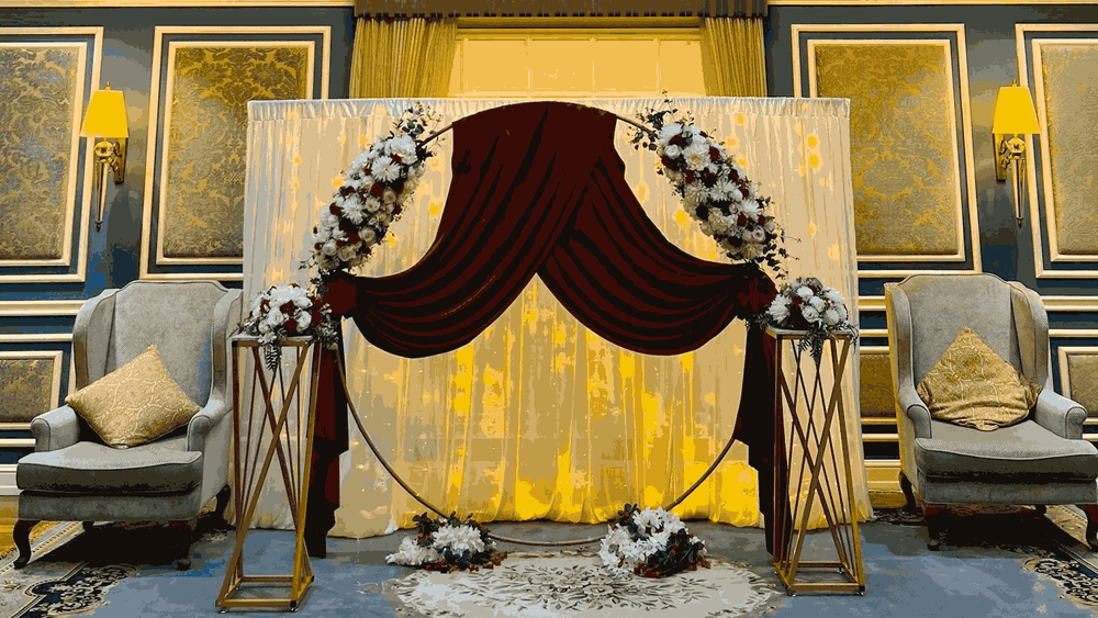 Blue Room event setup with floral decorations and chairs at Warwick Doha in Doha.