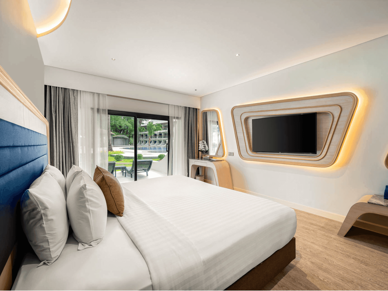 King bed & aesthetic mirror in Amora Ocean View at Amora Hotel