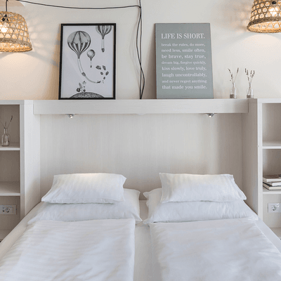 Double bed in Superior Room at Falkensteiner Hotel Park Punat