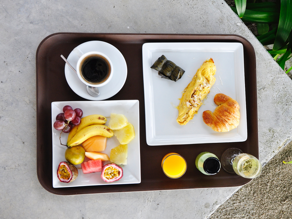 a tray of fruit and breakfast