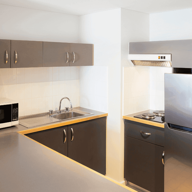 Kitchen in an apartment at Novotel Perth Langley