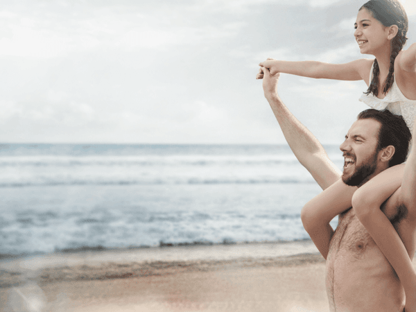 Father and daughter by the beach at Pierre Mundo Imperial