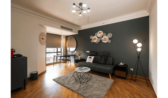 Park View Suite at YWCA Fort Canning Lodge, featuring a dark gray accent wall and stylish furniture