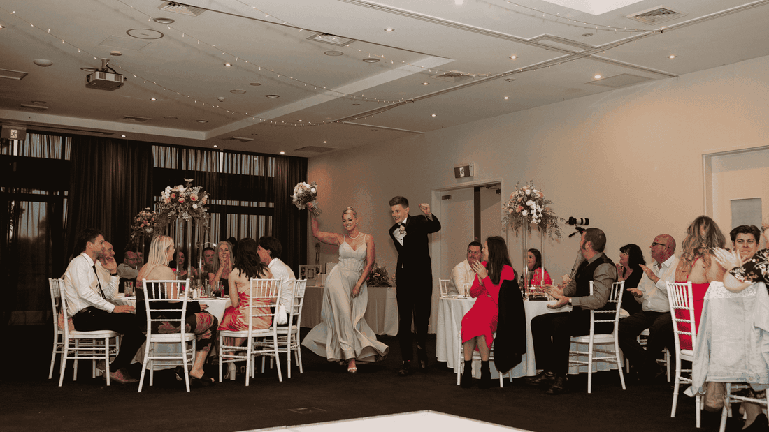 Indoor wedding reception with guests seated around tables at Mercure Kooindah Waters