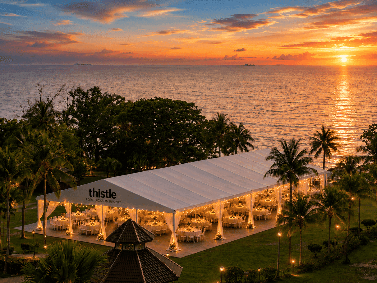 Marquee Tent at Thistle Port Dickson Resort is a majestic white structure on a lawn near the beachside