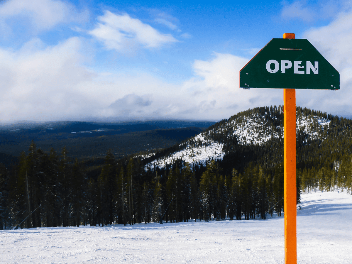 Open signboard on snow with a scenic view near Blackcomb Springs Suites