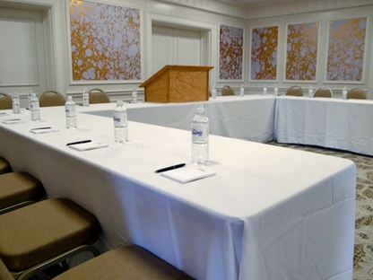 chairs at a u-shaped conference table