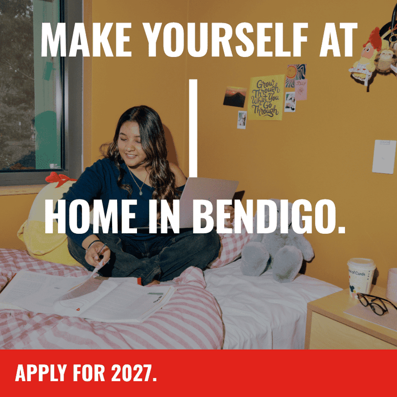 Student sitting on bed in a room at Living at La Trobe University student accommodation - The Villas