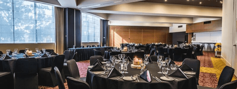 Banquet tables setup in a ballroom for event at Novotel Sydney