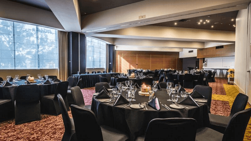 Banquet tables setup in a ballroom for event at Novotel Sydney