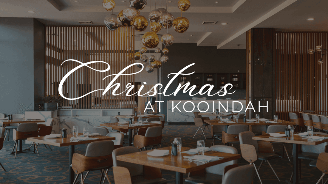 Elegant restaurant dining room with wooden tables, modern chairs, and golden pendant lights for Christmas Buffet Lunch 2026