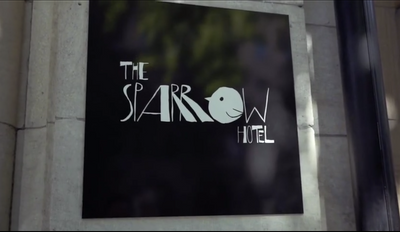 The hotel name board displayed on a wall at The Sparrow Hotel