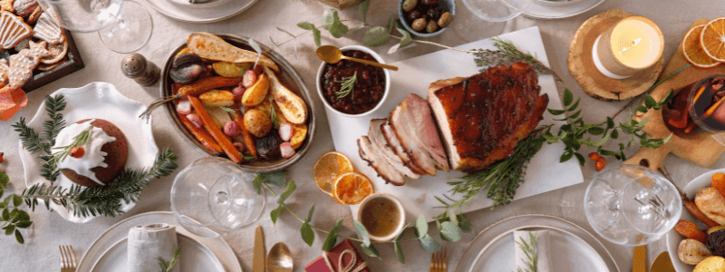 Christmas day lunch buffet with a roasted ham, vegetables, and festive decorations at Novotel Barossa Valley Resort