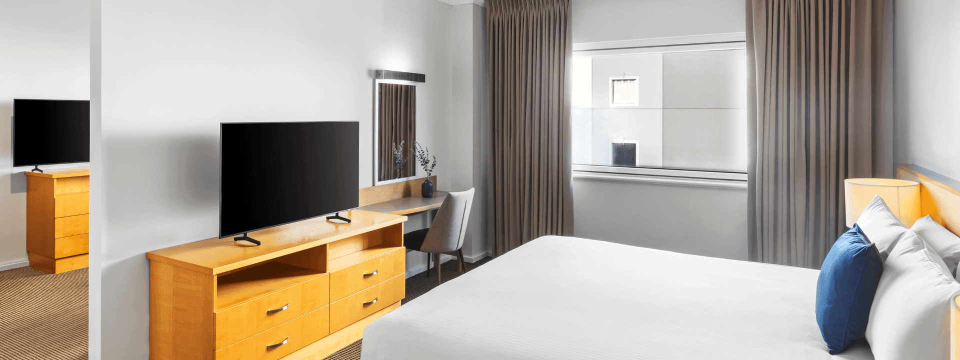 Comfortable bedroom in an Apartment at Novotel Perth Langley