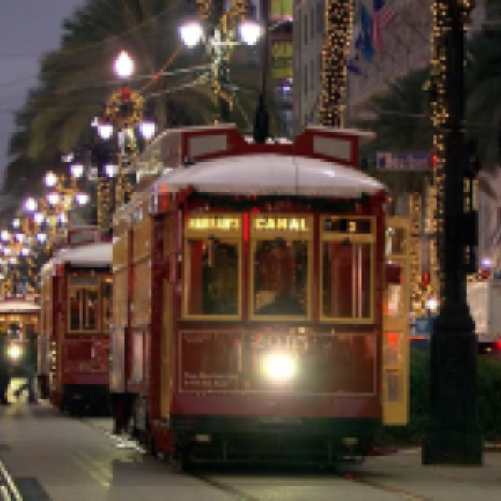 Streetcars at night in the city near La Galerie Hotel