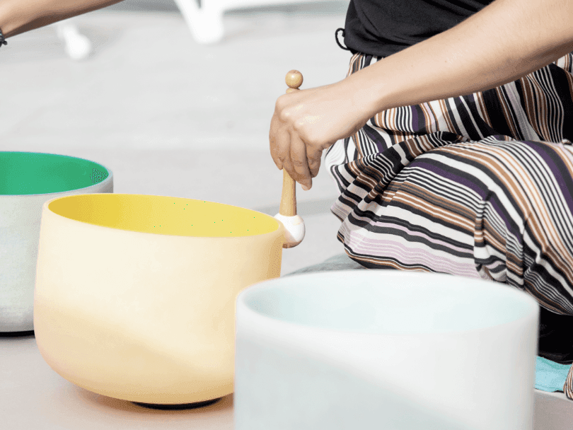 Sound Bath Instructor with sound bowls