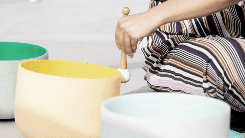 Sound Bath Instructor with sound bowls