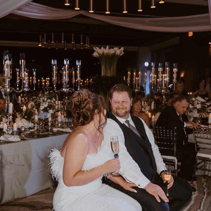 Shot of Newly Weds smiling surround by family and friends