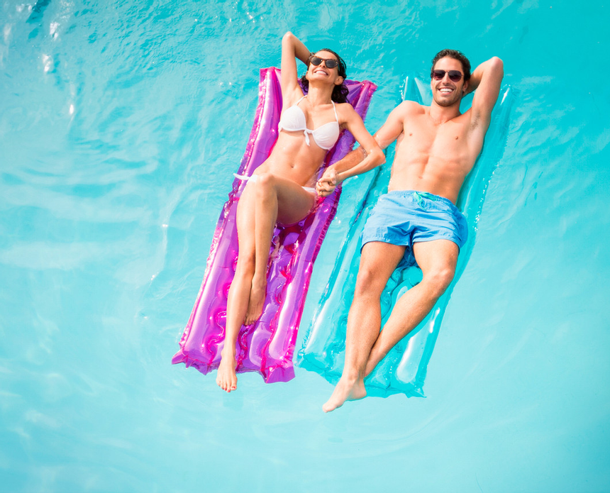 A couple spending time in the pool at Playa Blanca Beach Resort