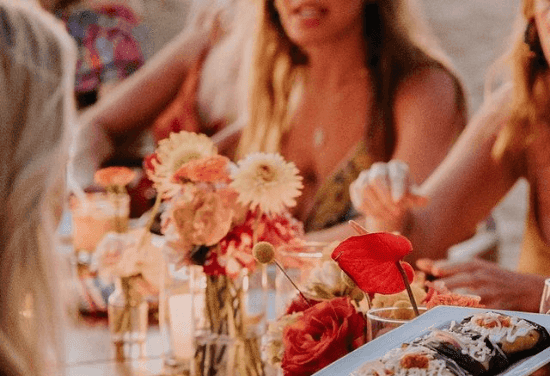 Close-up of floral table decorations at Marea Beachfront Villas