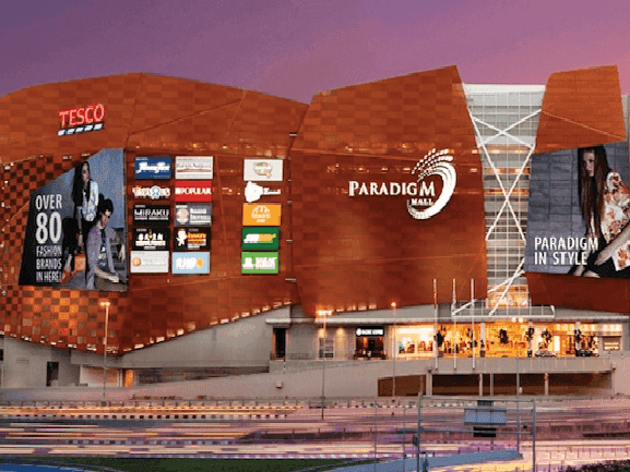 Exterior view of Paradigm Mall featuring a unique orange facade near Saujana Hotel Kuala Lumpur