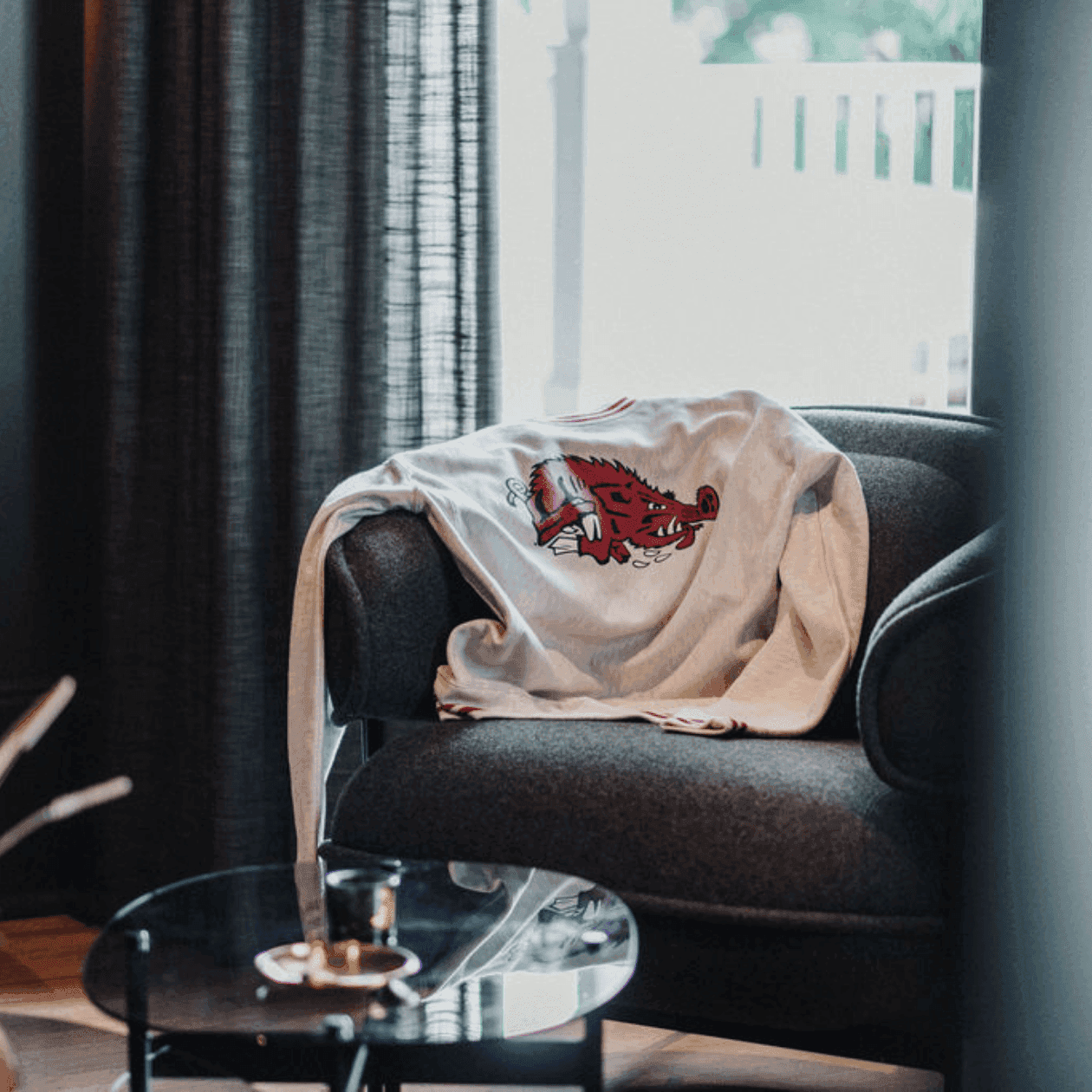 Room with chair and shirt depicting a hog for Stonebreaker Game Day event.