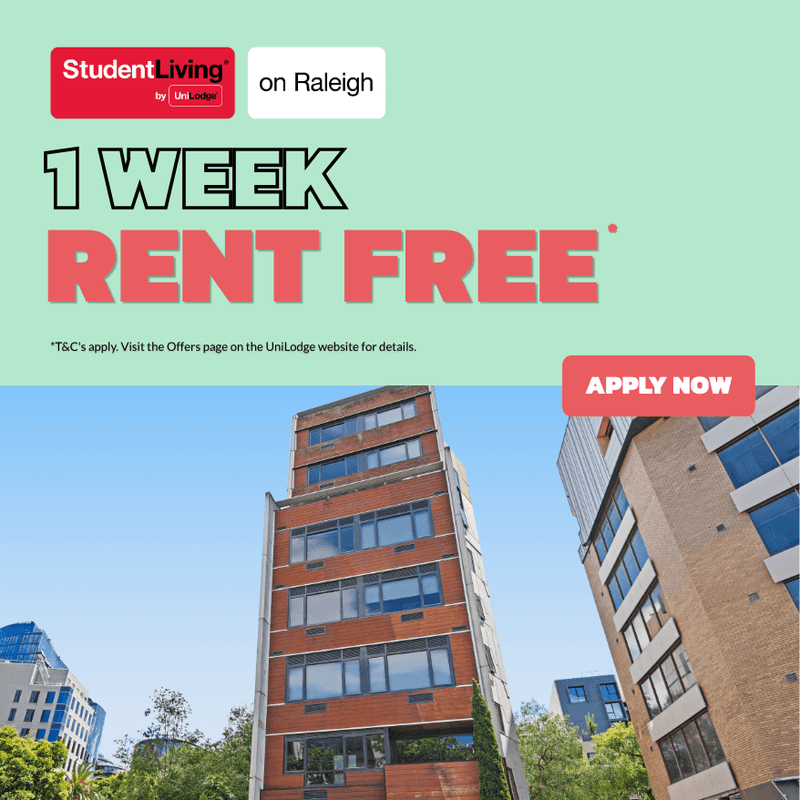 Modern student accommodation building with red brick facade and large windows under clear blue sky with promotional offer.